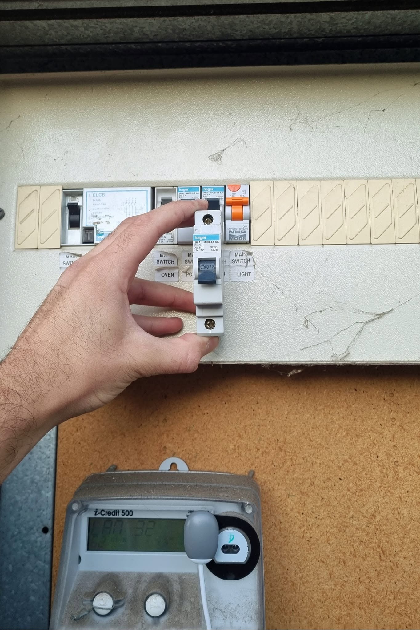 Electrician working on a residential electrical switchboard